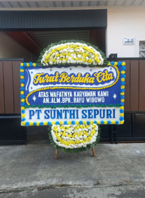 Papan Bunga Duka di Baki