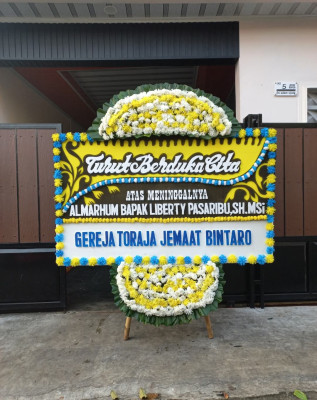 Papan Bunga Duka di Baki