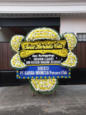 Papan Bunga Duka di Baki
